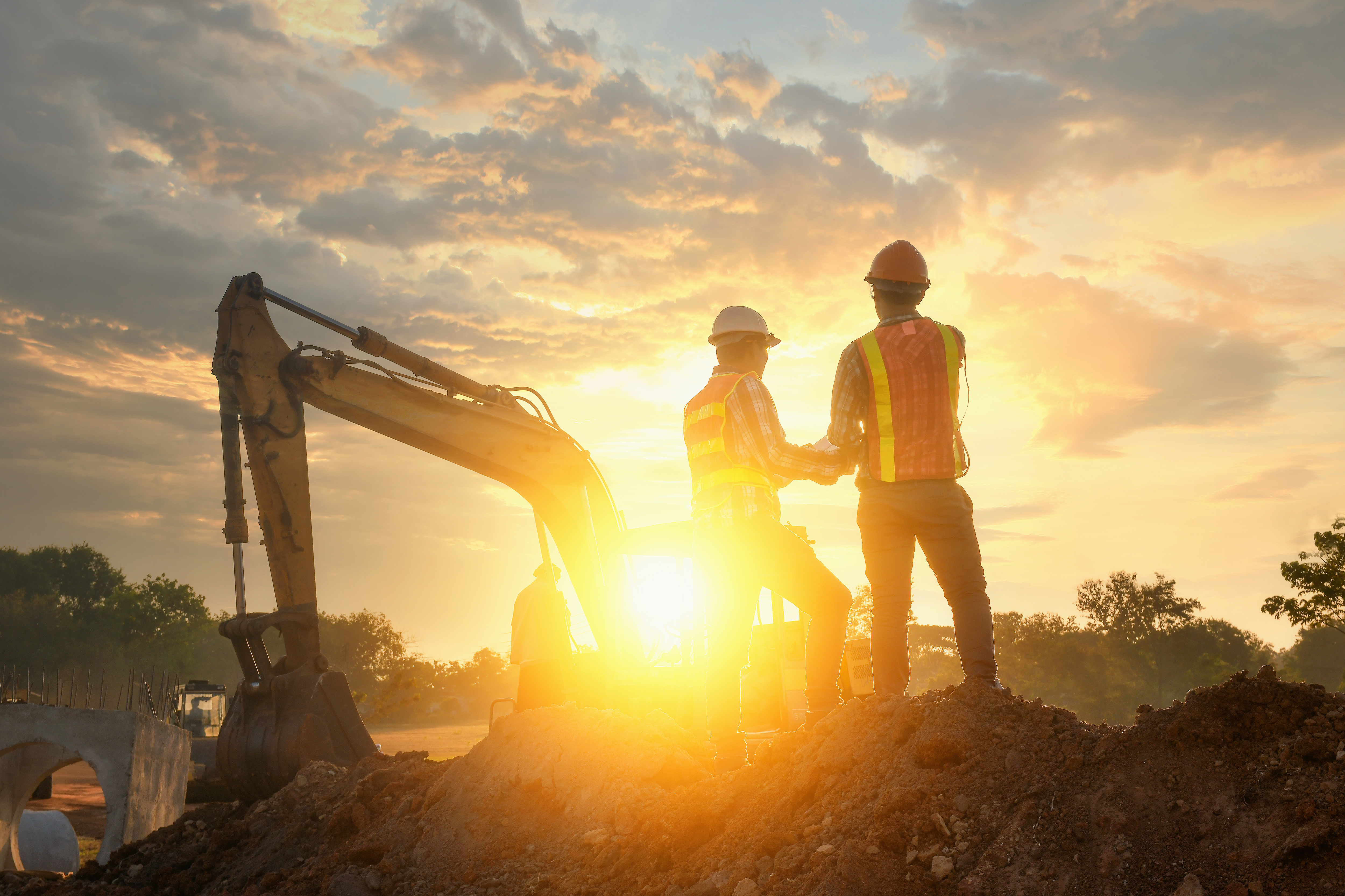 Engineers are working on road construction. engineer holdingradi